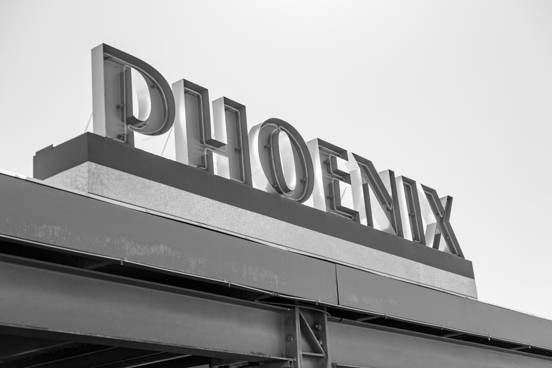 Professional technician performing AC repair Phoenix home outdoor condenser unit